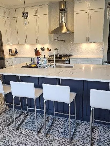 Modern kitchen with pendant lights, recessed ceiling lights, and under-cabinet lighting