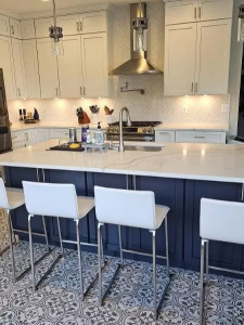 bright remodeled kitchen with central island, pendant lights, cabinets, and modern appliances